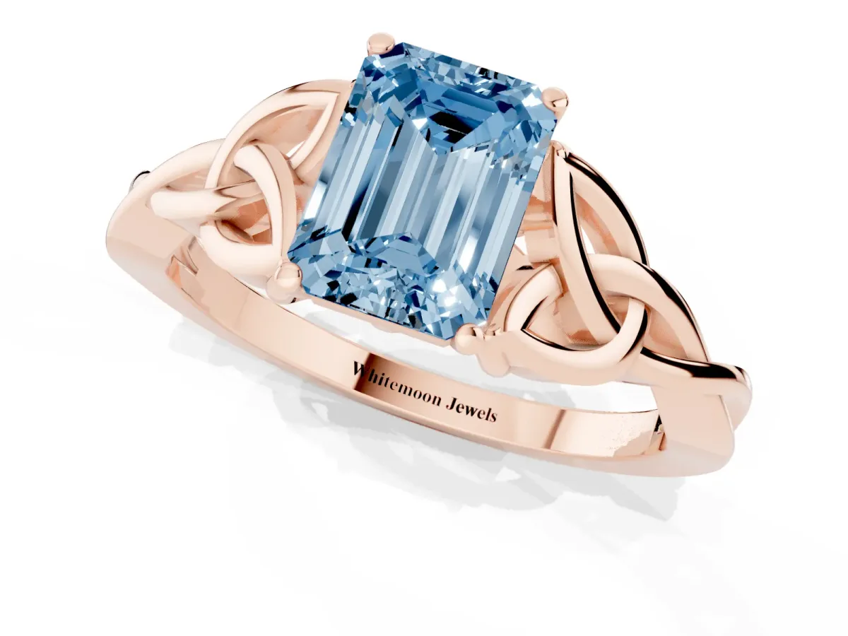 Fancy Blue Emerald Cut Diamond Solitaire Engagement Ring with Celtic Knot Band and Four-Prong Setting Rose gold