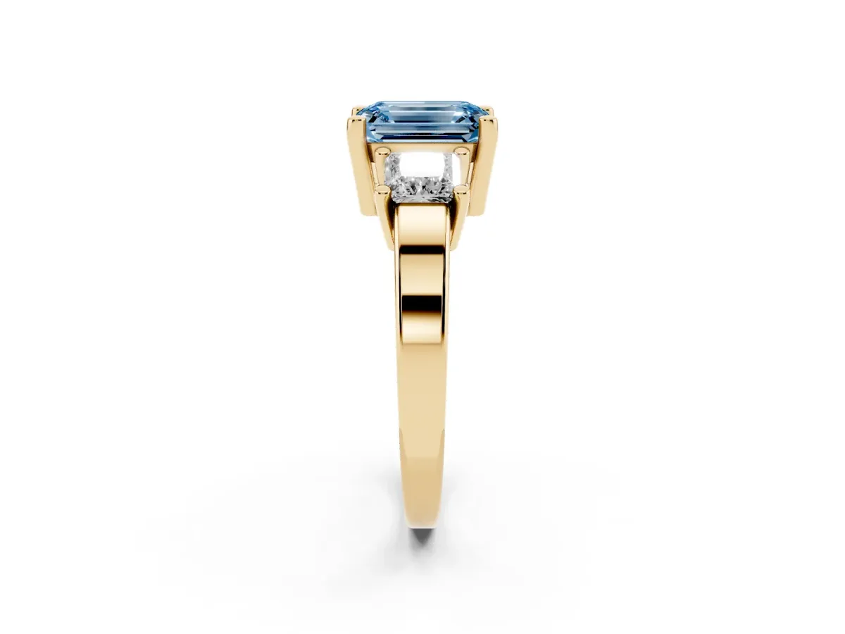 Fancy Blue Three-Stone Emerald Cut Cut Solitaire Ring with Prong Setting Yellow gold