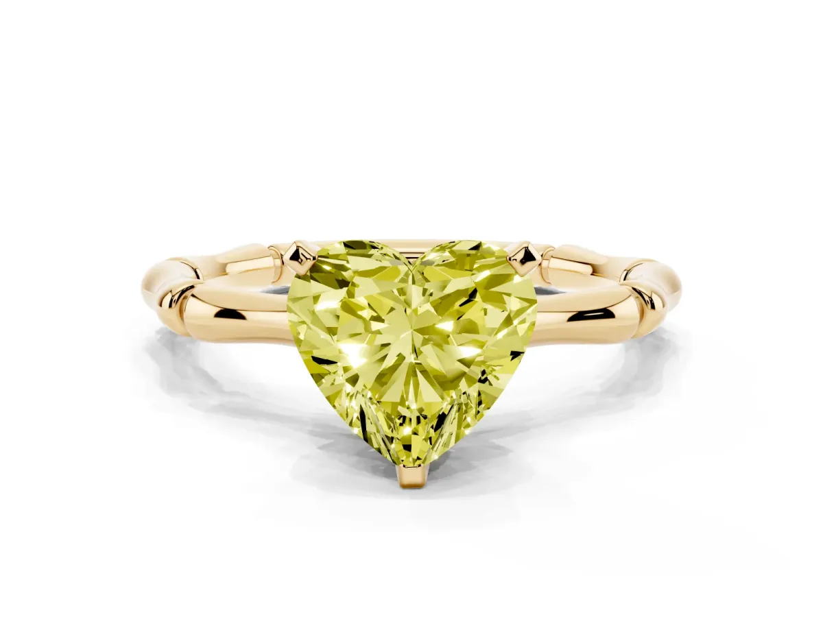 Fancy Yellow Heart Cut Solitaire Diamond Ring with Bamboo Band and Four-Prong Setting Yellow gold
