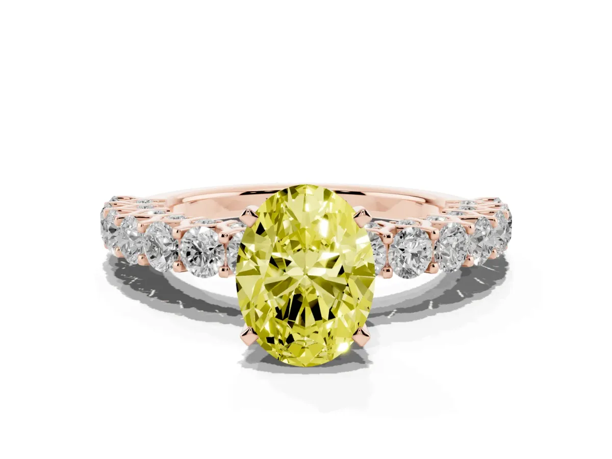Fancy Yellow Oval Cut Diamond Solitaire Ring with Shared Prong Pavé Band and Four-Prong Setting Rose gold