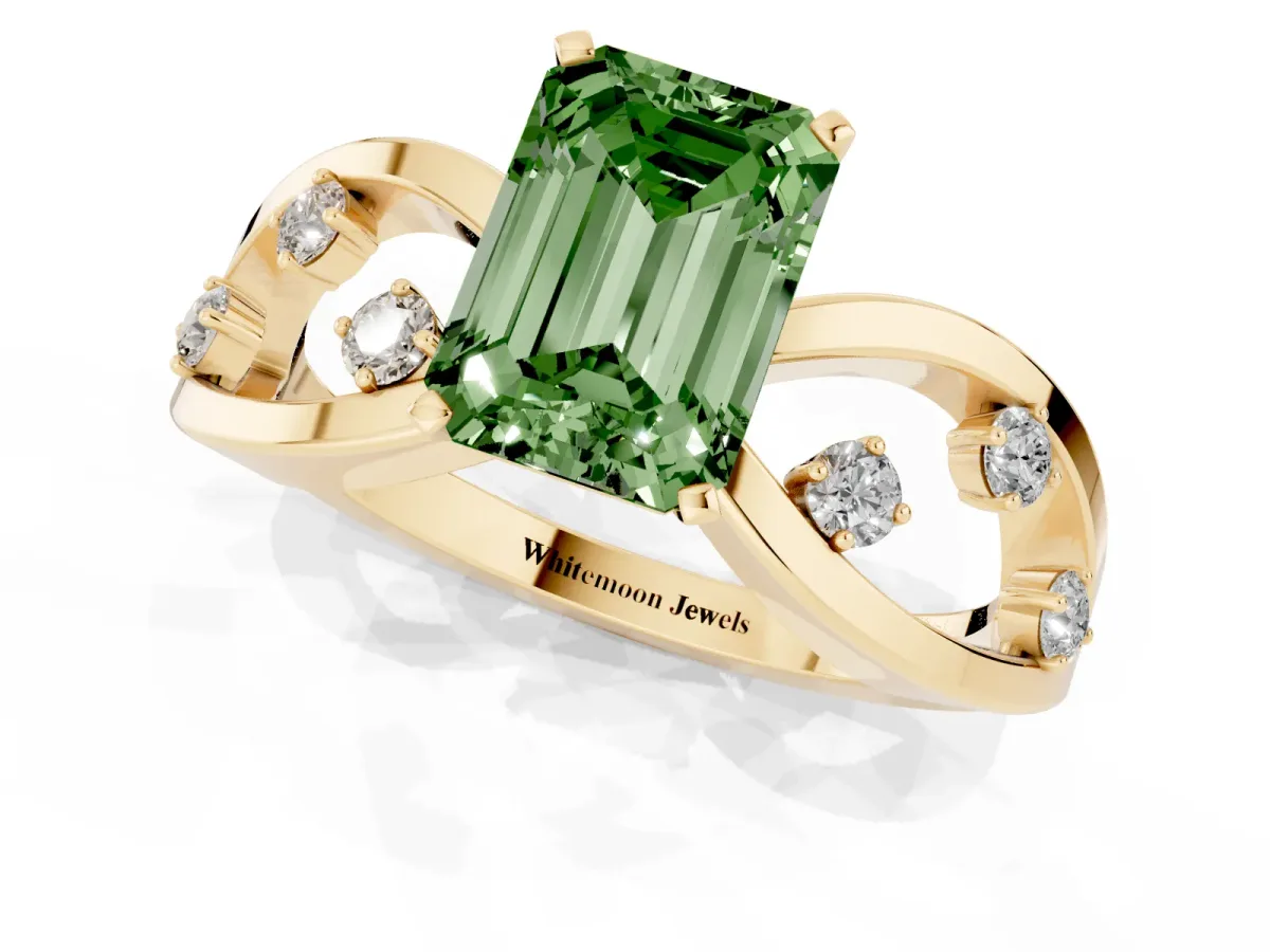 Fancy Green Emerald Cut Cut Solitaire Diamond with Side Stones on Criss-Cross Band and Four-Prong Setting Yellow gold