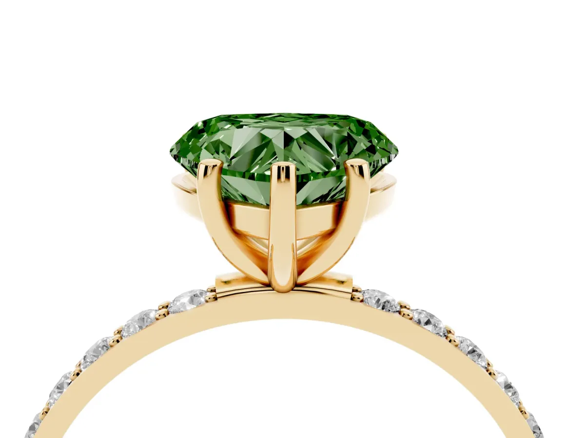 Fancy Green Heart Cut Diamond Solitaire Ring with Round Pavé Shoulders and Prong Setting Yellow gold
