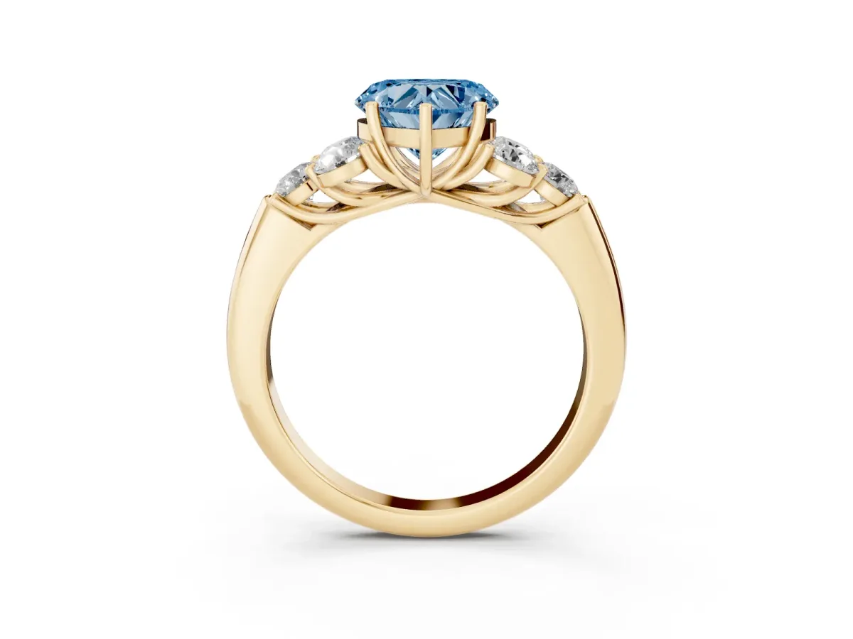 Fancy Blue Heart Cut Cut Diamond Cluster Ring with Round Accent Stones and Prong Setting on a Classic Band Yellow gold