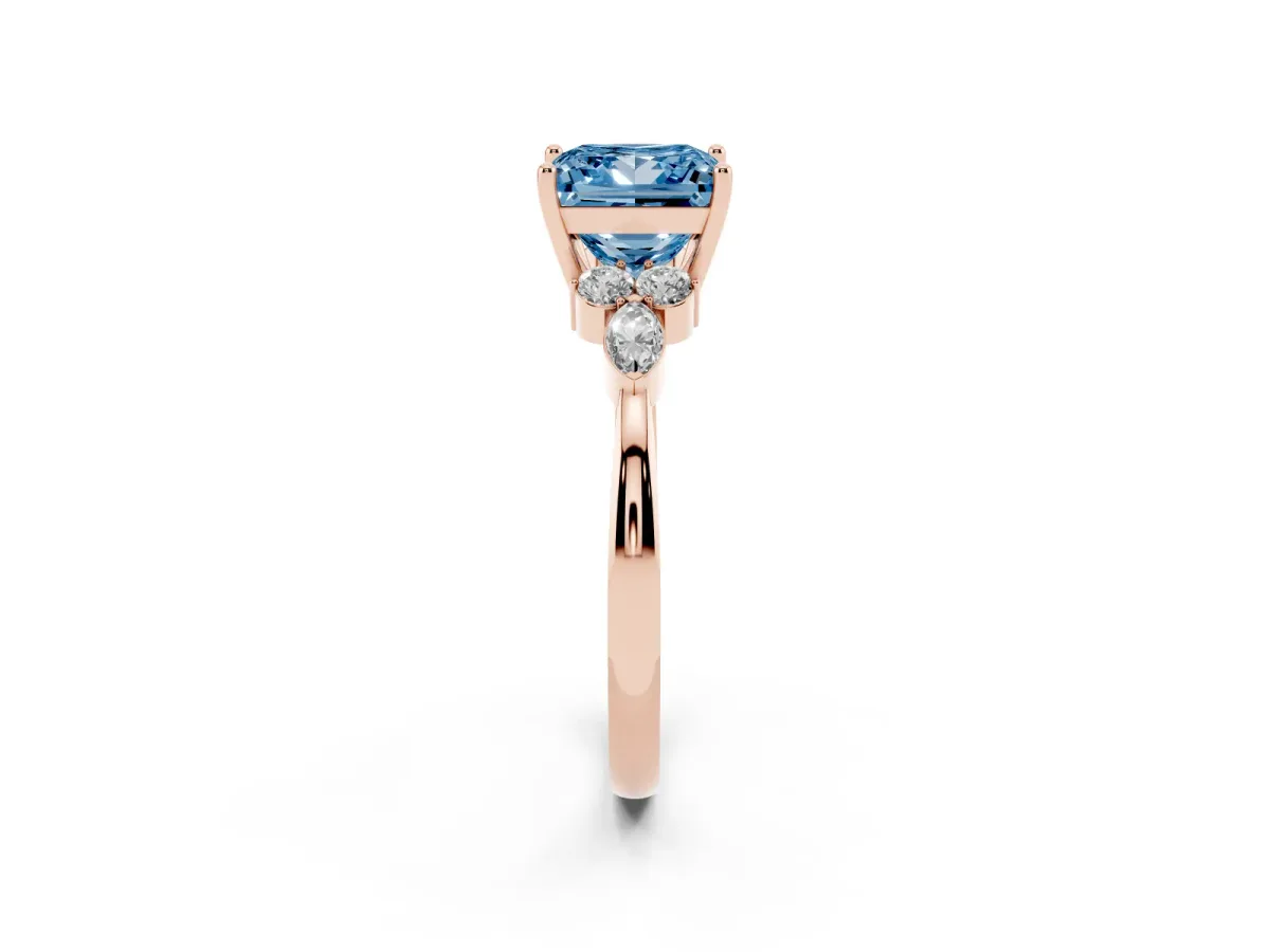 Fancy Blue Princess Cut Brilliant Diamond Solitaire Ring with Pear Side Stones and Four-Prong Setting Rose gold