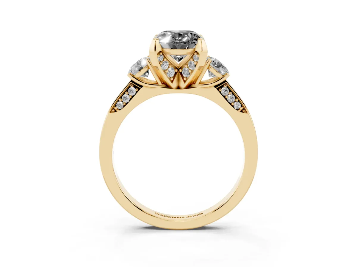 Fancy Black Oval Cut Brilliant Three-Stone Diamond Ring with Pavé Band and Four-Prong Setting Yellow gold
