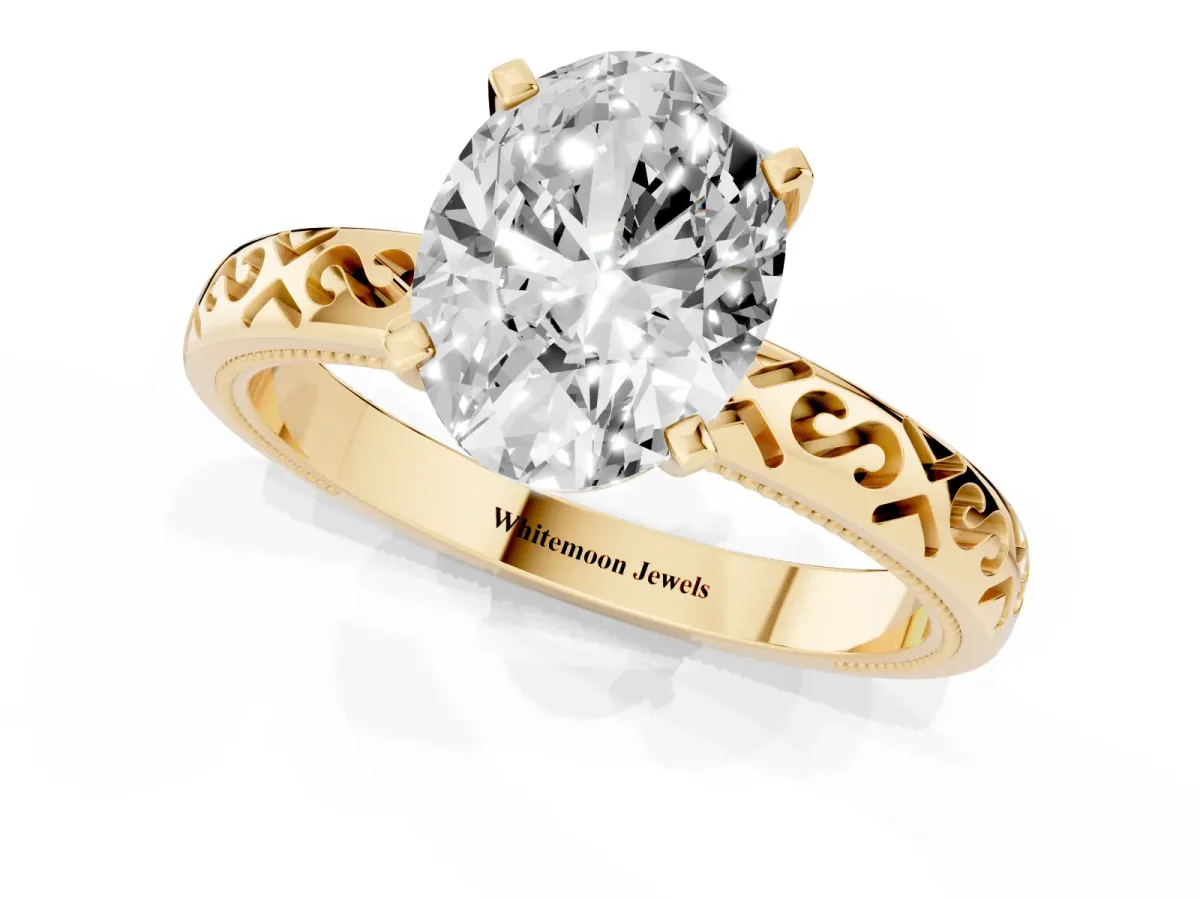 Oval Cut Solitaire Engagement Ring with Scrollwork Band and Four-Prong Setting Yellow gold