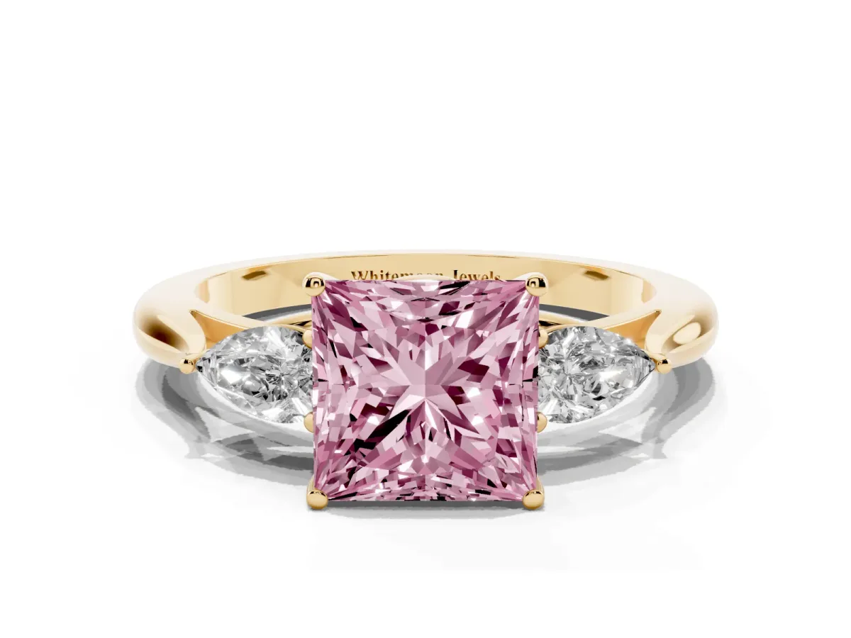 Fancy Pink Three-Stone Princess Cut Brilliant Diamond Solitaire Ring with Tapered Band and Four-Prong Setting Yellow gold