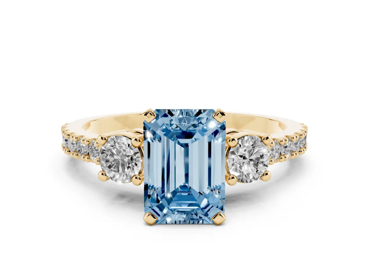 Fancy Blue Emerald Cut Three-Stone Diamond Pavé Band with Prong Setting Yellow gold