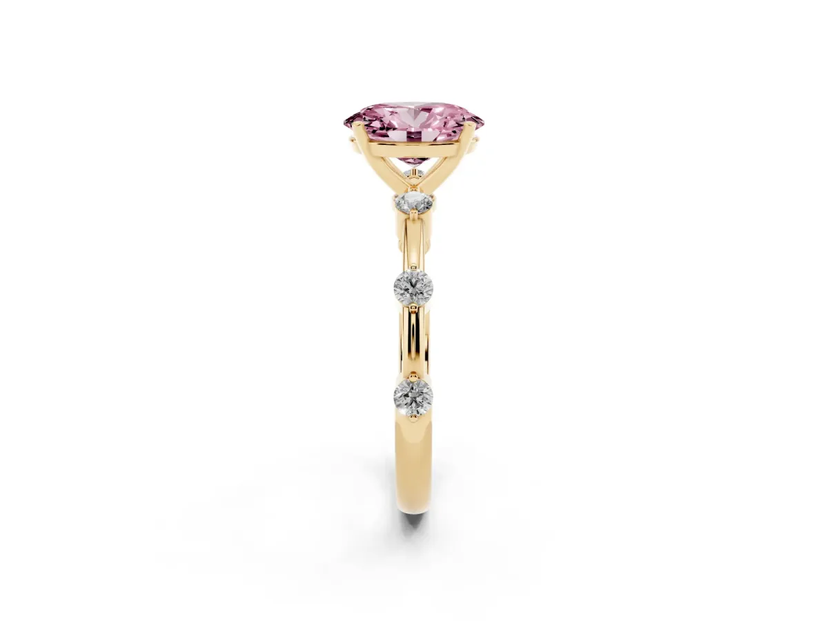 Fancy Pink Oval Cut Solitaire Diamond Ring with Bezel Set Side Stones and Prong Setting Yellow gold