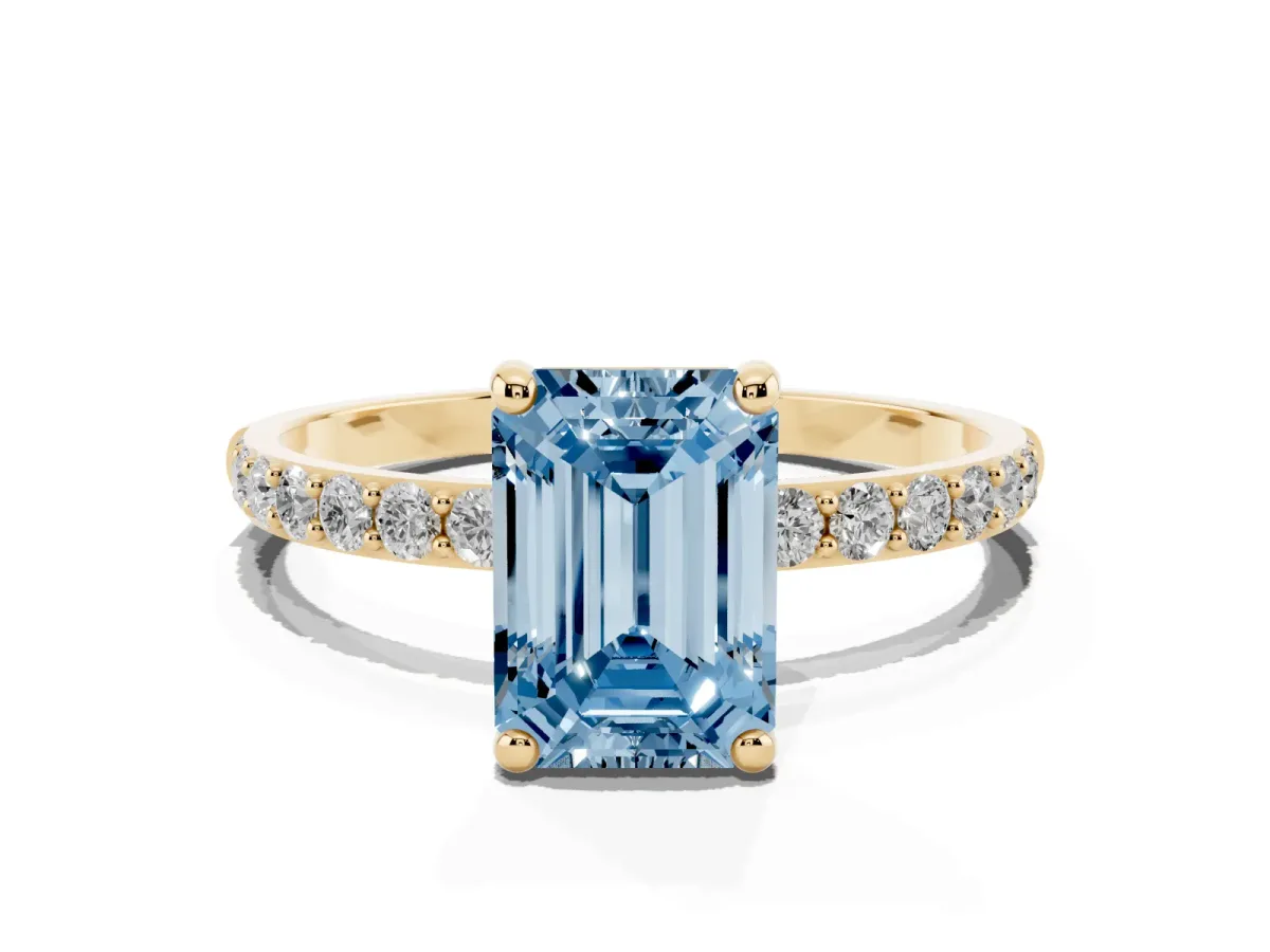 Fancy Blue Emerald Cut Diamond Solitaire Ring with Round Pavé Band and Prong Setting Yellow gold