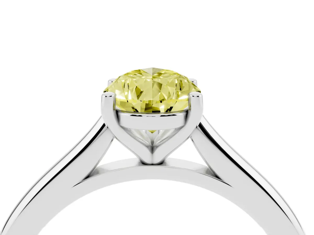 Fancy Yellow Pear Cut Cut Solitaire Ring with Cathedral Band and Four-Prong Setting Silver