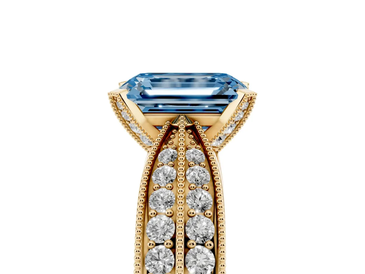 Fancy Blue Emerald Cut Diamond Solitaire Ring with Milgrain Round Pavé Band and Prong Setting Yellow gold