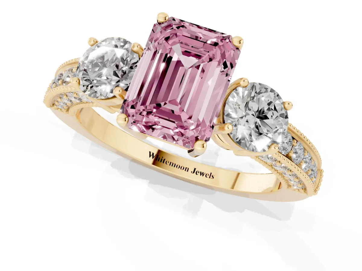 Fancy Pink Emerald Cut Three-Stone Diamond Ring with Pavé Band and Four-Prong Setting Yellow gold