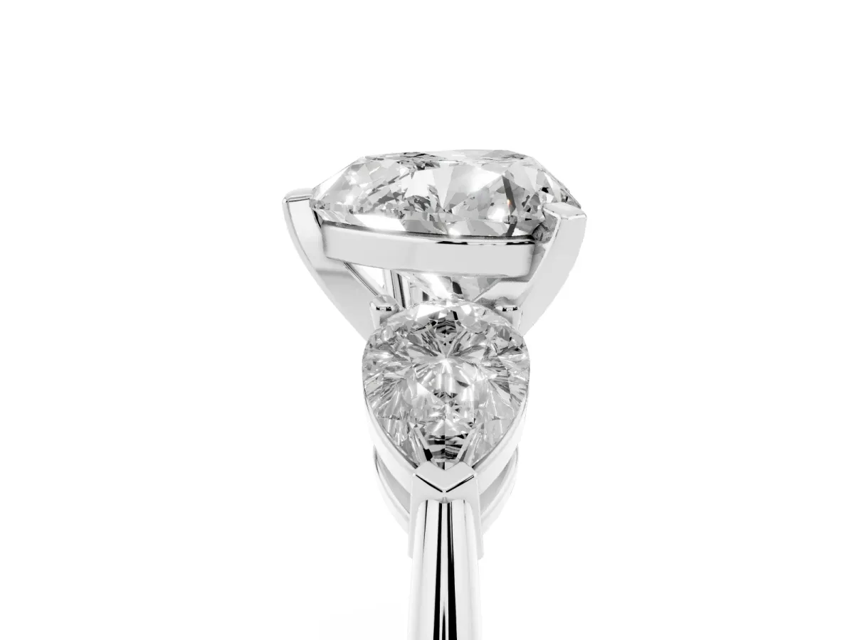 Three-Stone Heart Cut Diamond Ring with Pear Side Stones and Four-Prong Setting Platinum