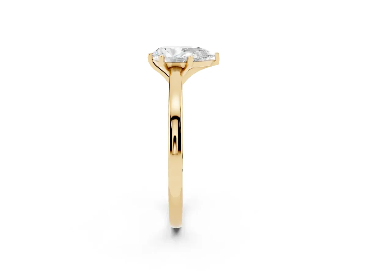 Pear Cut Solitaire Diamond Engagement Ring with Four-Prong Setting on a Classic Band Yellow gold