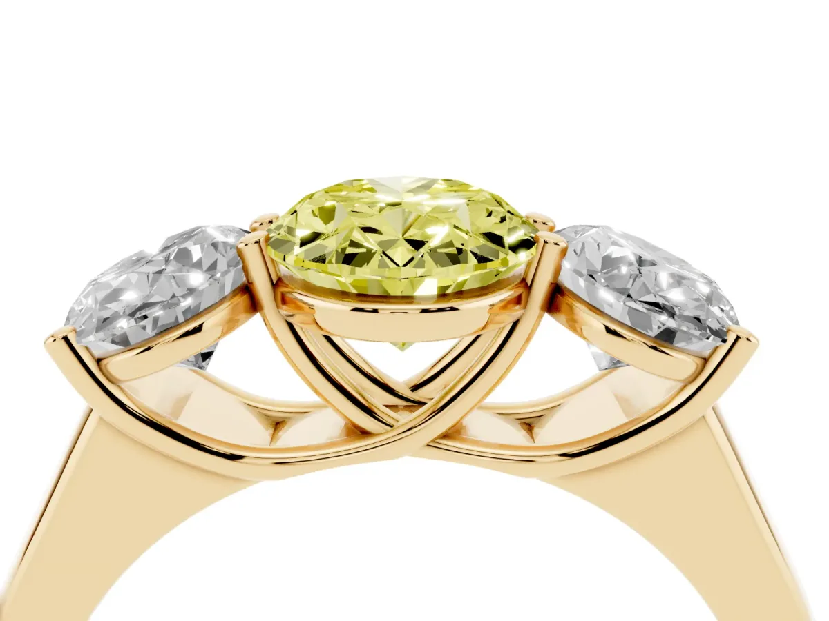 Fancy Yellow Oval Cut Three-Stone Diamond Ring with Prong Setting on a Classic Band Yellow gold