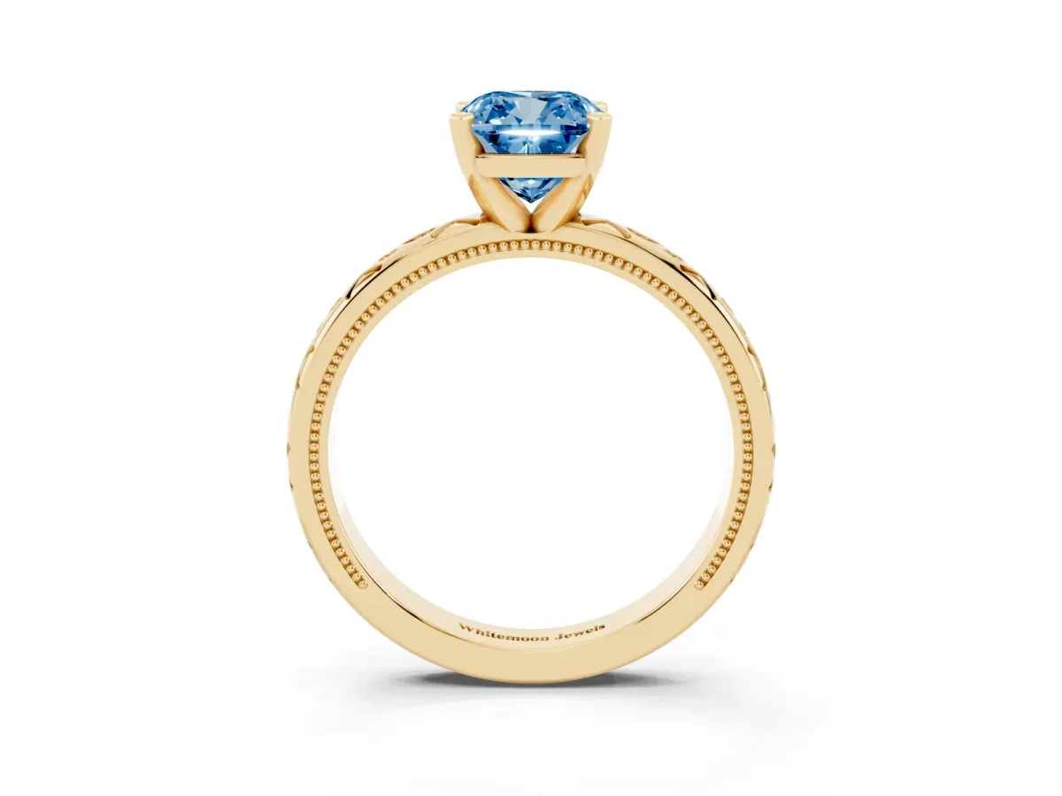 Fancy Blue Cushion Cut Solitaire Engagement Ring with Scrollwork Band and Four-Prong Setting Yellow gold