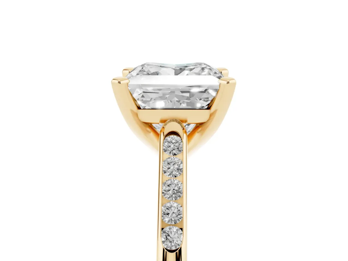 Princess Cut Diamond Solitaire Ring with Channel Set Round Band and Prong Setting Yellow gold