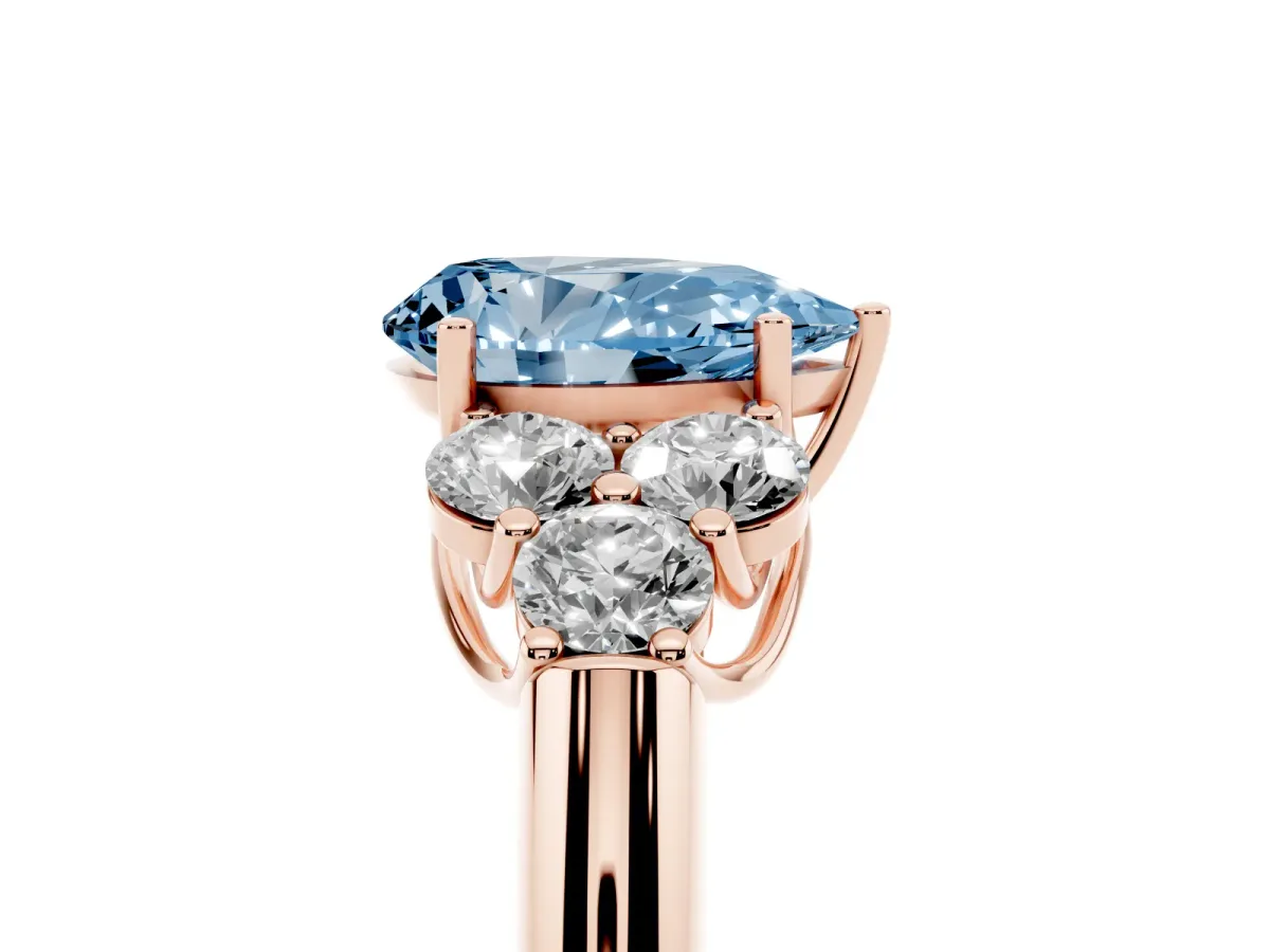 Fancy Blue Pear Cut Cut Diamond Cluster Ring with Round Accent Stones and Prong Setting on a Classic Band Rose gold