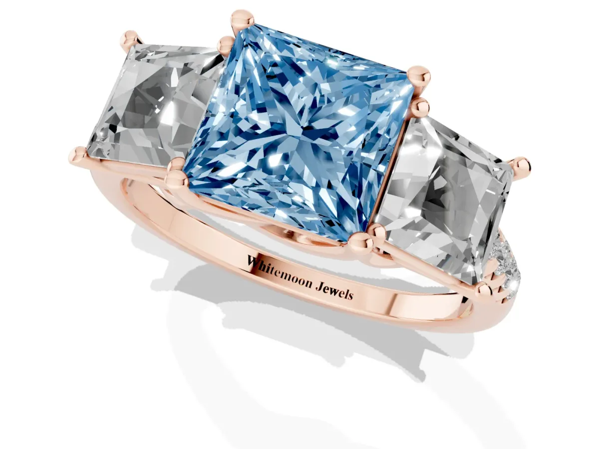 Fancy Blue Three-Stone Princess Cut Diamond Ring with Round Pavé Band and Prong Setting Rose gold