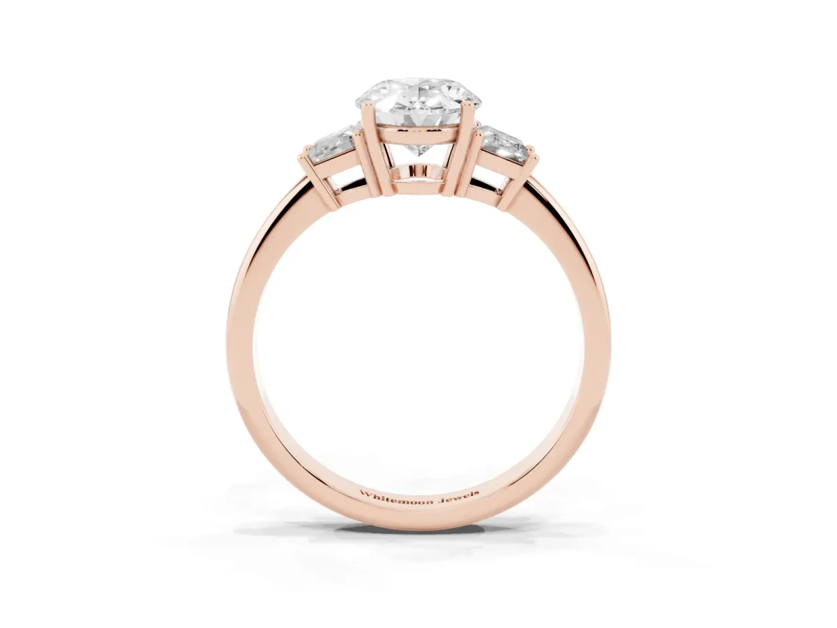 Oval Cut Diamond Three-Stone Ring with Trapezoid Side Stones and Prong Setting Rose gold