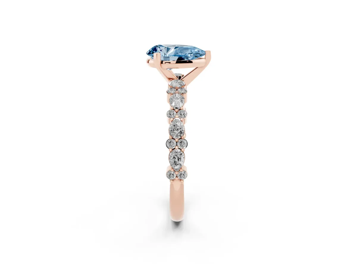 Fancy Blue Pear Cut Diamond Side Stone Solitaire Ring with Round and Four-Prong Setting Rose gold
