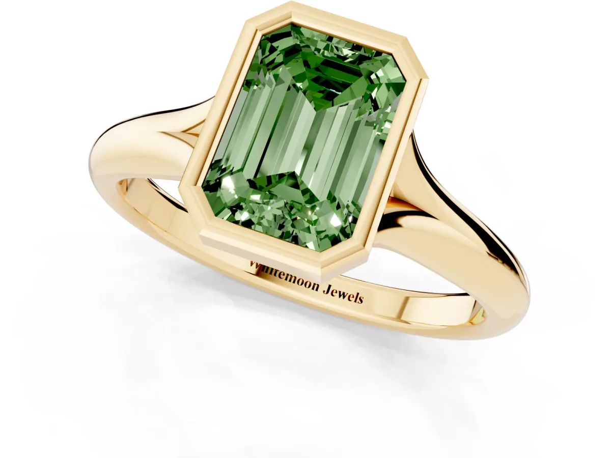 Fancy Green Bezel Set Emerald Cut Solitaire Diamond Ring with Smooth Band Yellow gold