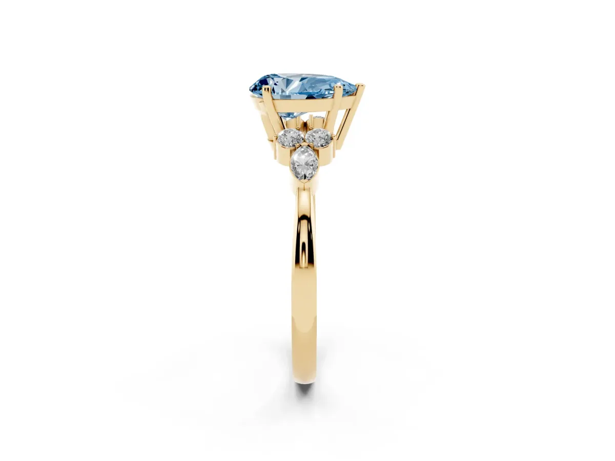Fancy Blue Pear Cut Brilliant Diamond Solitaire Ring with Pear Side Stones and Four-Prong Setting Yellow gold