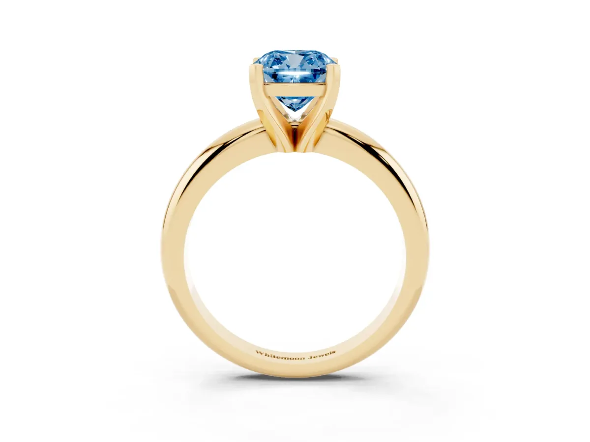 Fancy Blue Cushion Cut Diamond Solitaire Engagement Ring with Round Band and Four-Prong Setting Yellow gold