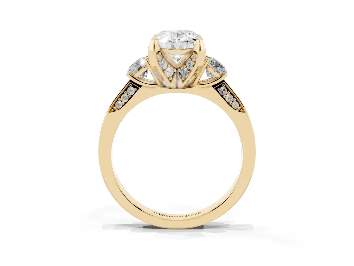 Oval Cut Brilliant Three-Stone Diamond Ring with Pavé Band and Four-Prong Setting Yellow gold