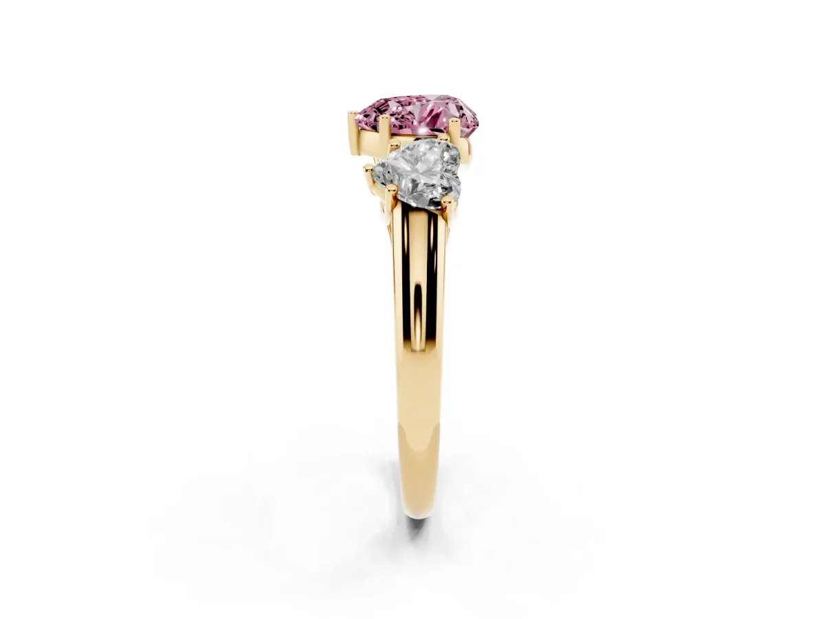 Fancy Pink Three-Stone Heart Cut Diamond Engagement Ring with Prong Setting Yellow gold