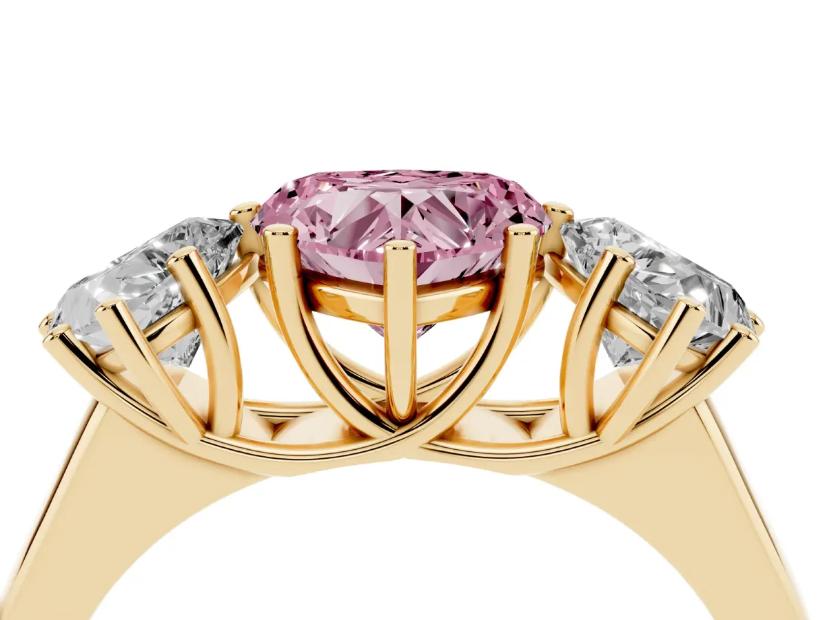Fancy Pink Heart Cut Three-Stone Diamond Ring with Prong Setting on a Classic Band Yellow gold