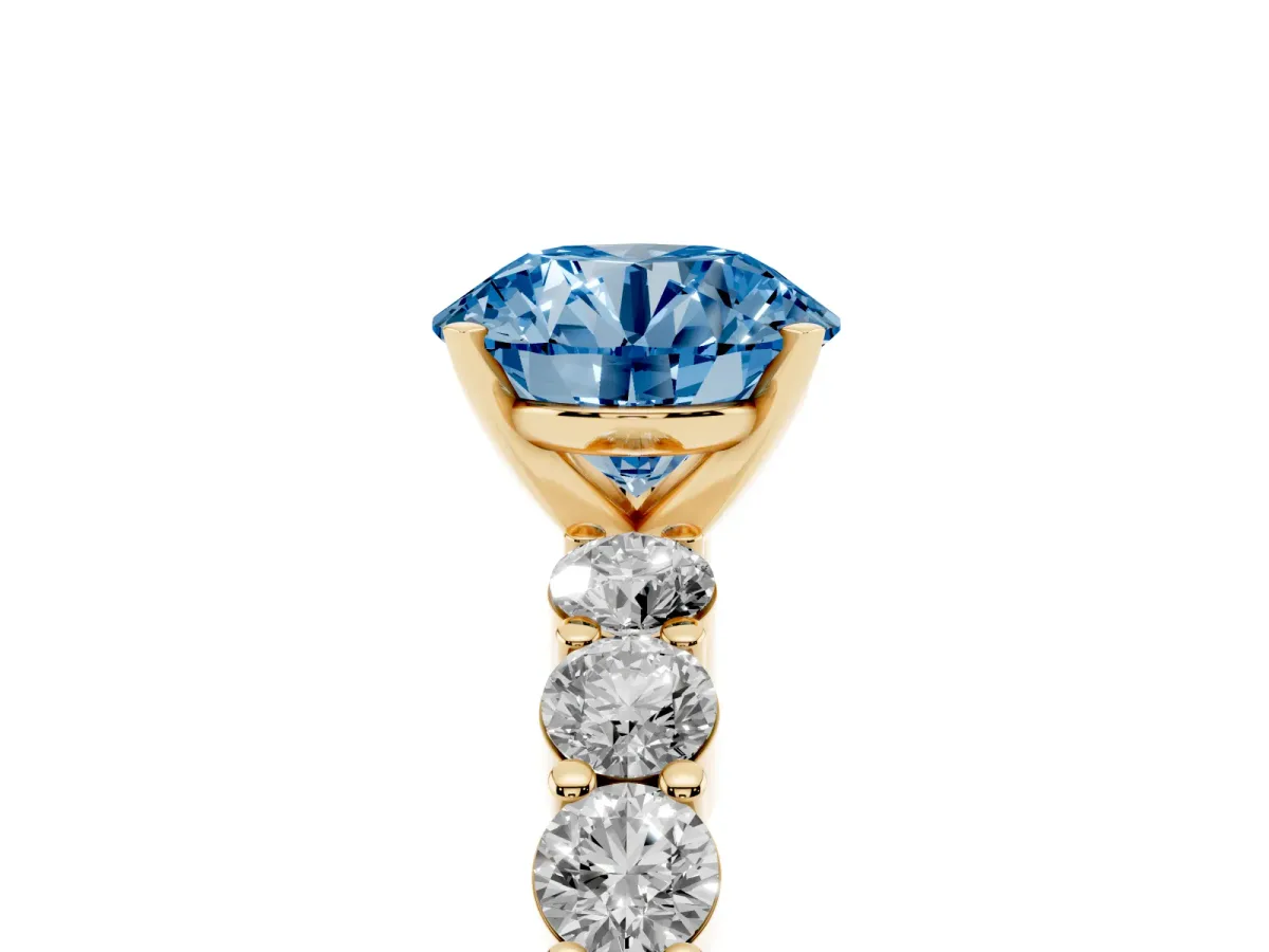 Fancy Blue Round Cut Diamond Solitaire Ring with Shared Prong Round Side Stones Yellow gold