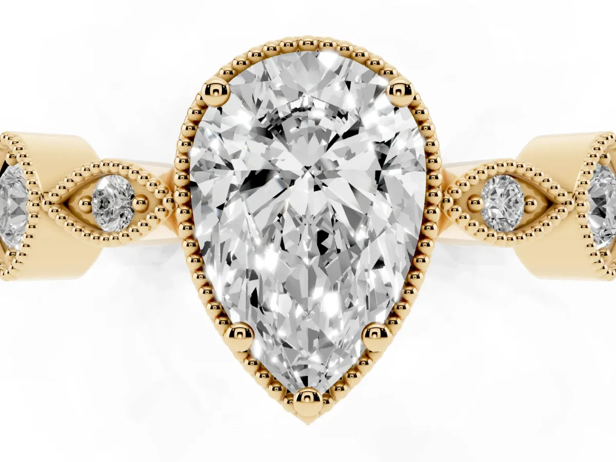 Pear Cut Diamond Vintage Milgrain Ring with Round Stations Yellow gold