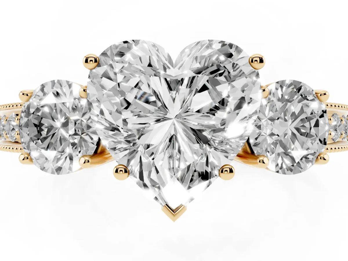 Heart Cut Three-Stone Diamond Ring with Pavé Band and Four-Prong Setting Yellow gold