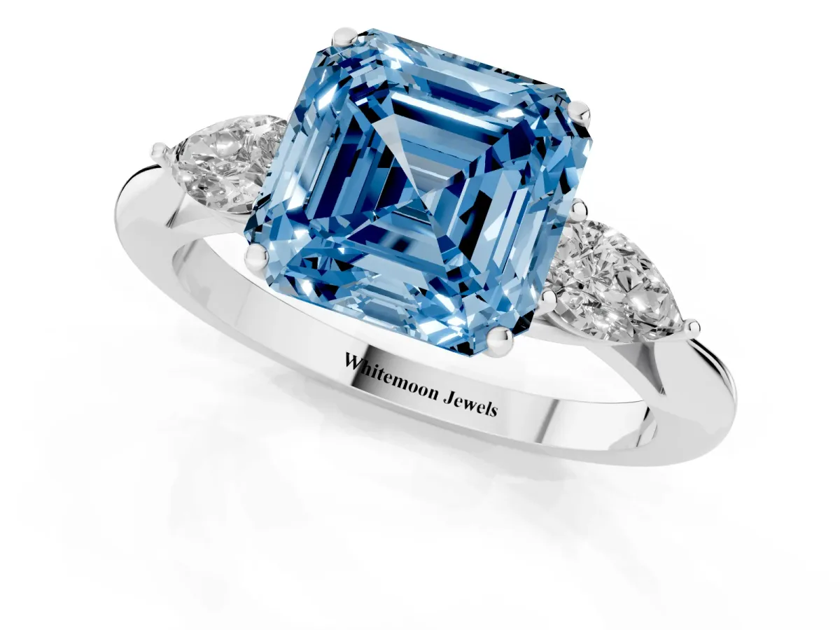 Fancy Blue Asscher Cut Diamond Three-Stone Ring with Pear Side Stones and Prong Setting Platinum