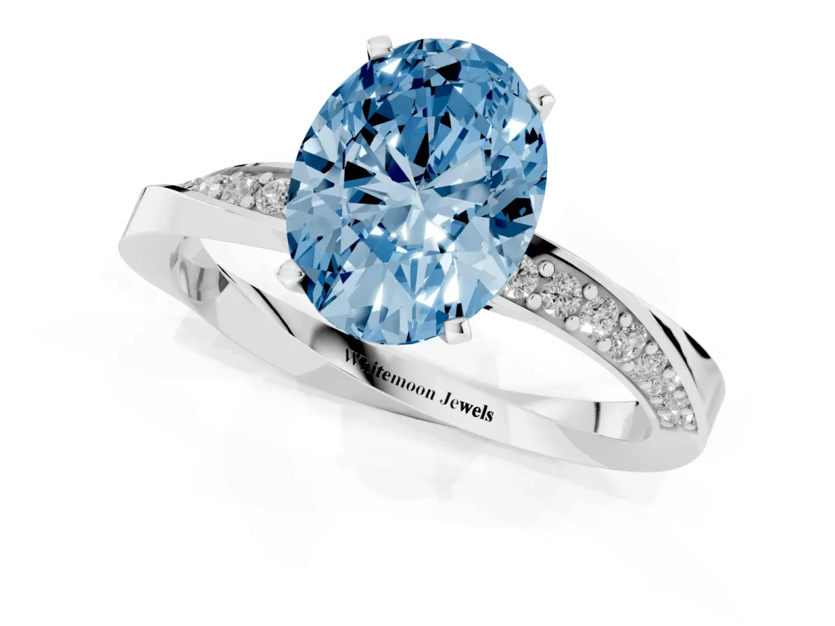 Fancy Blue Oval Cut Diamond Engagement Ring with Side Stone Accents and Four-Prong Setting Silver