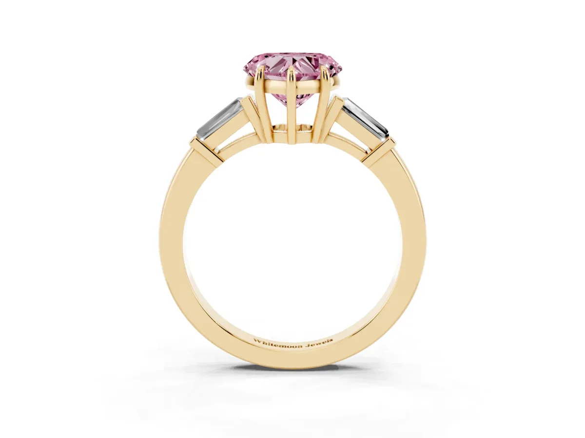Fancy Pink Heart Cut Diamond Three-Stone Ring with Tapered Baguette Side Stones and Prong Setting Yellow gold