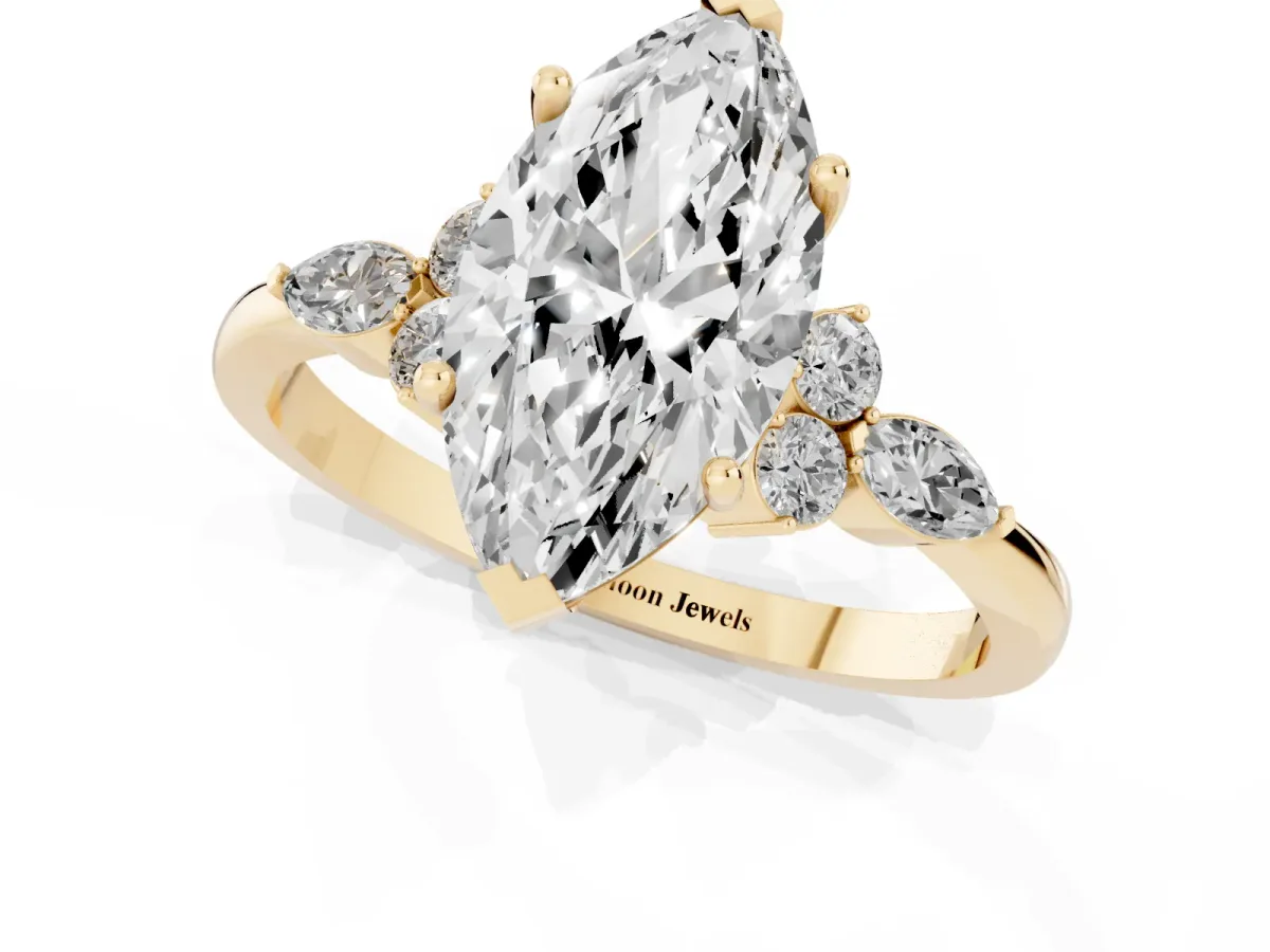 Marquise Cut Brilliant Diamond Solitaire Ring with Pear Side Stones and Four-Prong Setting Yellow gold