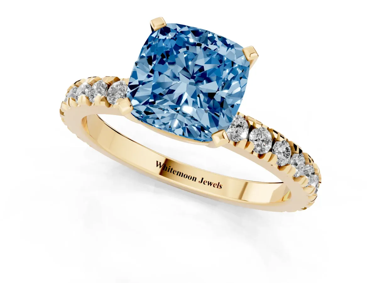 Fancy Blue Cushion Cut Diamond Pavé Band Solitaire with Four-Prong Setting Yellow gold