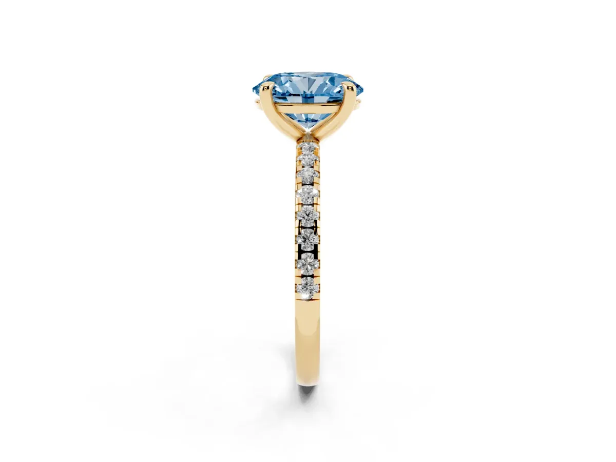 Fancy Blue Oval Cut Diamond Brilliant Solitaire Ring with Pavé Band and Four-Prong Setting Yellow gold