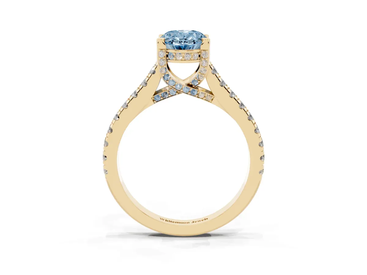 Fancy Blue Oval Cut Brilliant Diamond Solitaire with Pavé Band and Four-Prong Setting Yellow gold