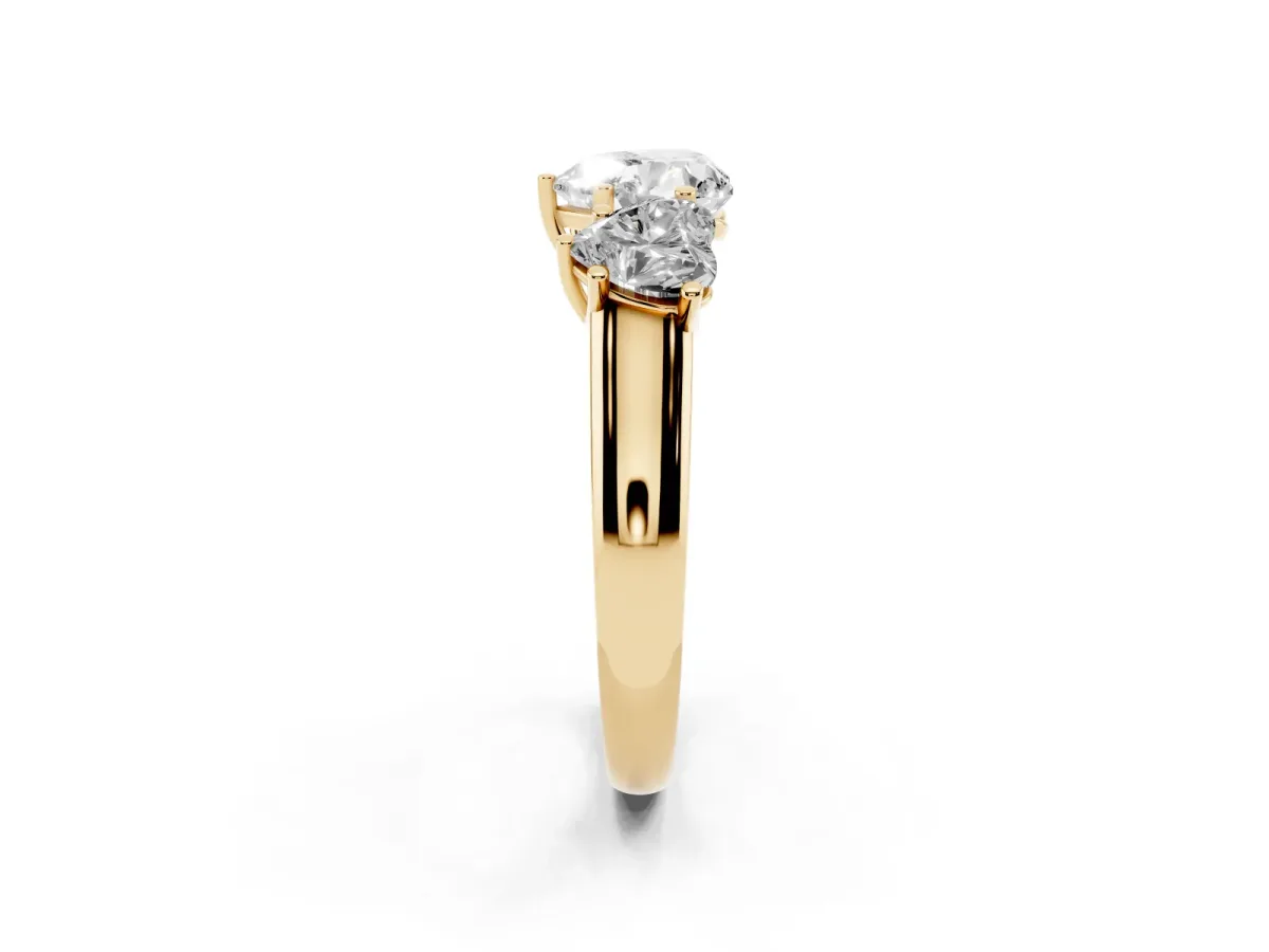 Heart Cut Three-Stone Diamond Ring with Prong Setting on a Classic Band Yellow gold