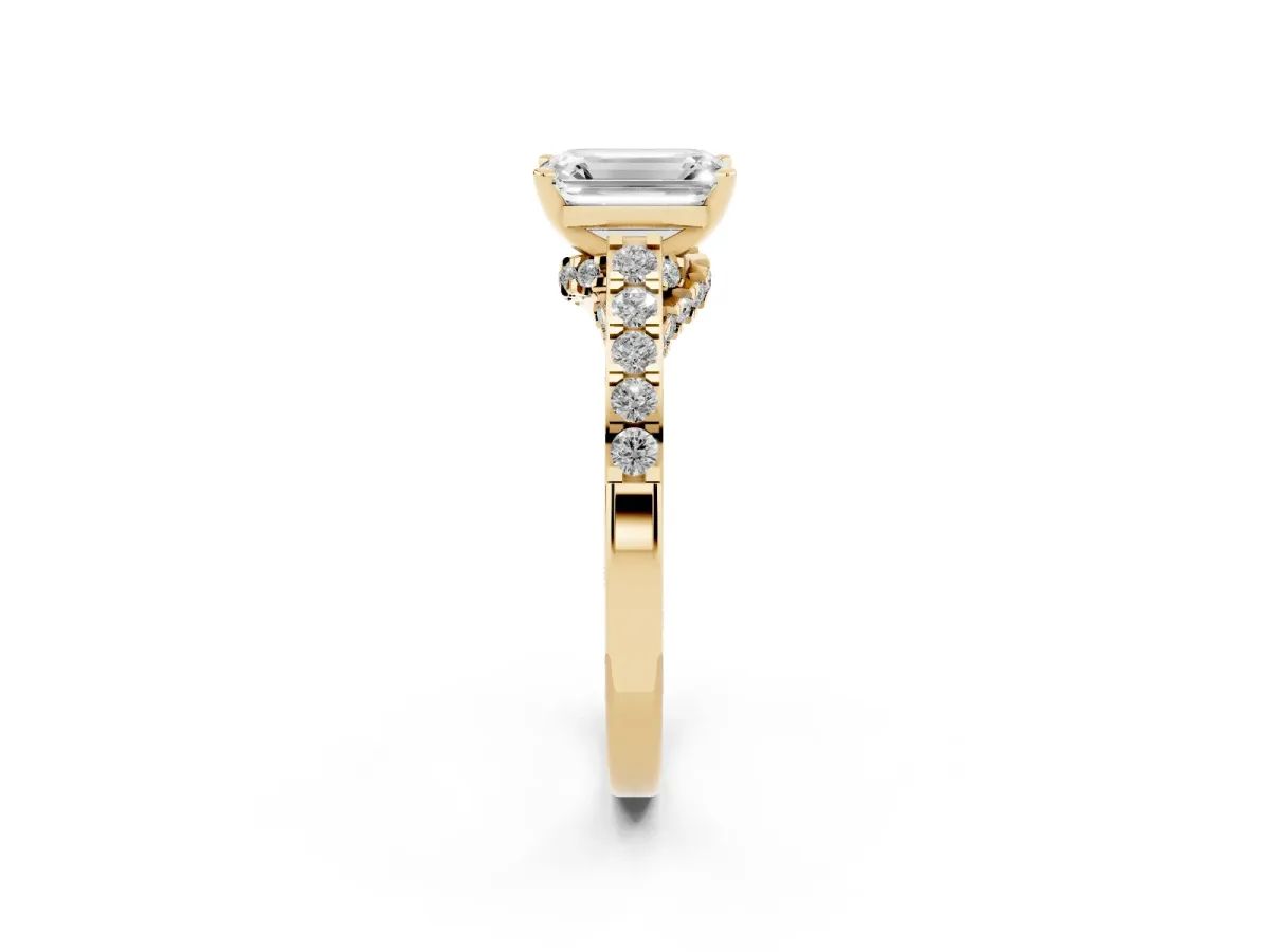Emerald Cut Diamond Solitaire Ring with Crossover Gallery and Round Pavé Band Yellow gold