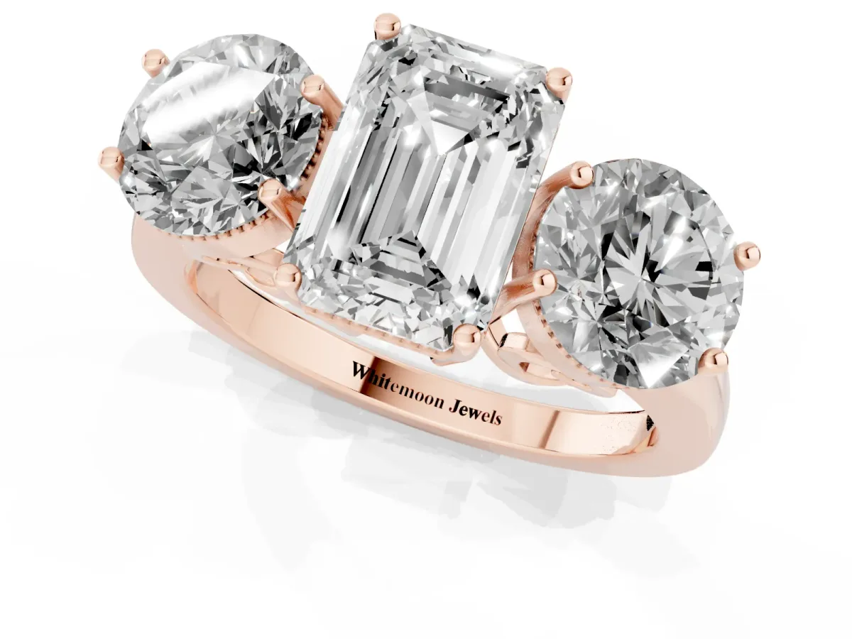 Three-Stone Emerald Cut Diamond Engagement Ring with Prong Setting on a Classic Band Rose gold