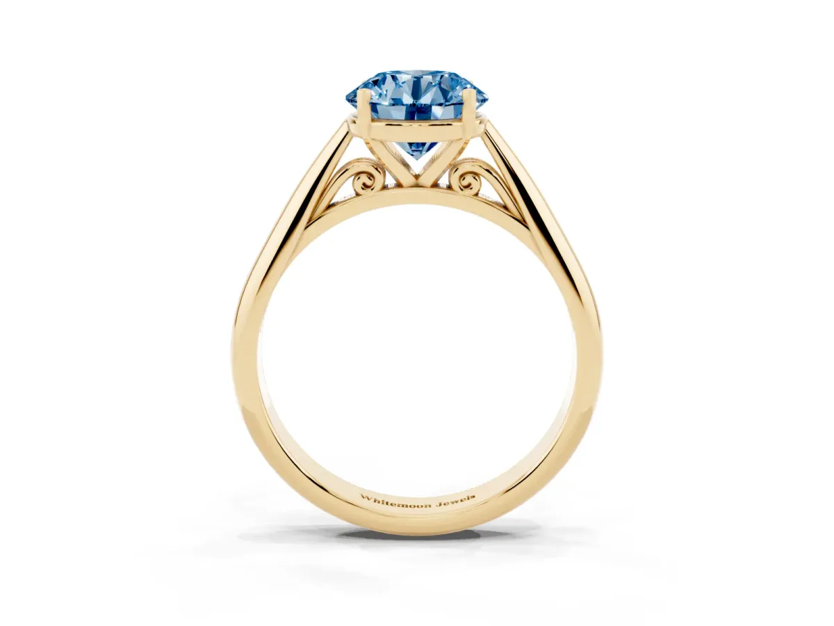Fancy Blue Round Cut Diamond Solitaire Engagement Ring with Cathedral Setting and Four-Prong Mount Yellow gold