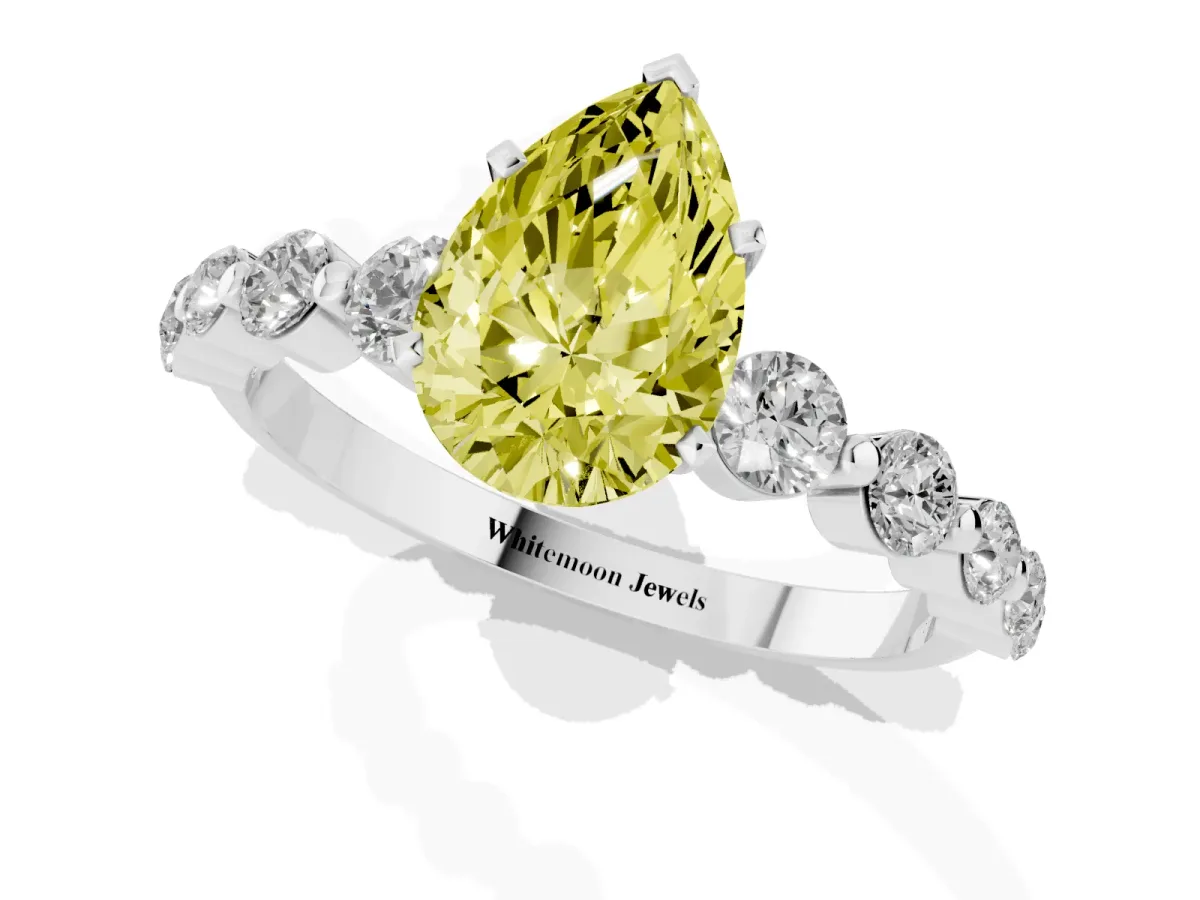 Fancy Yellow Pear Cut Solitaire Diamond Ring with Pave Band and Four-Prong Setting Silver
