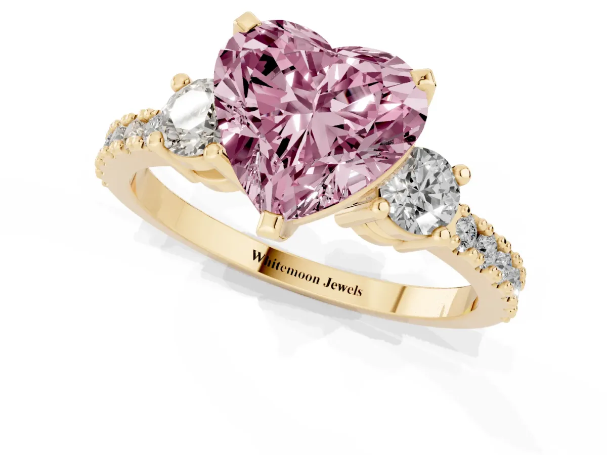 Fancy Pink Heart Cut Three-Stone Diamond Pavé Band with Prong Setting Yellow gold