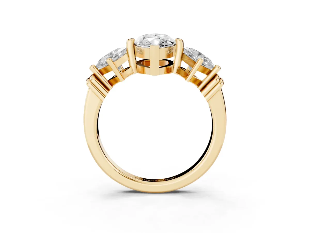 Three-Stone Marquise Cut and Princess Cut Diamond Ring with Channel Band and Four-Prong Setting Yellow gold