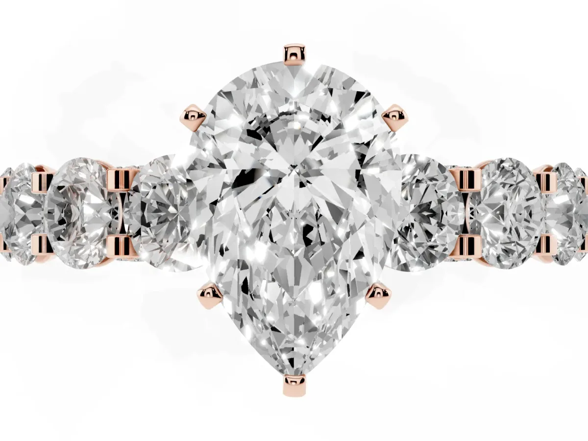 Pear Cut Diamond Side Stone Engagement Ring with Four-Prong Setting Rose gold
